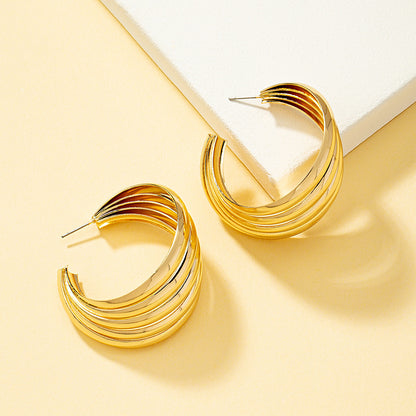 Aros de Estilo Hamaca Bañados en Oro de 18K